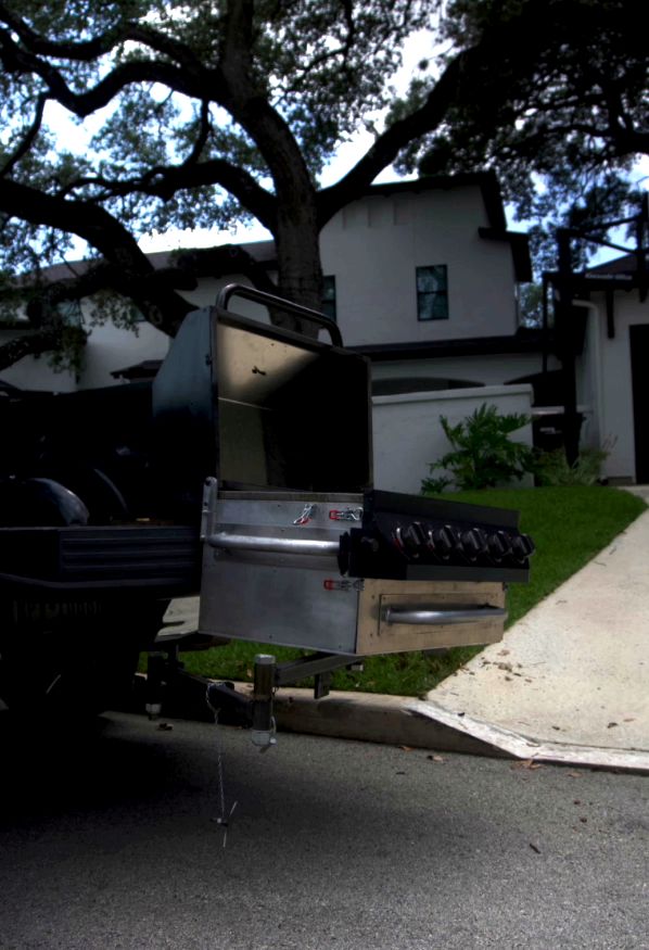 GrillGate swing arm extended, opening full access to the cook chamber